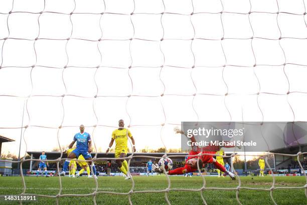 Victor Adeboyejo of Bolton Wanderers scores the team's first goal past Craig MacGillivray of Burton Albion during the Sky Bet League One match...