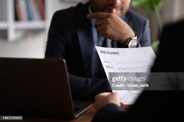business man review his resume application on desk, laptop computer, job seeker - cv bildbanksfoton och bilder