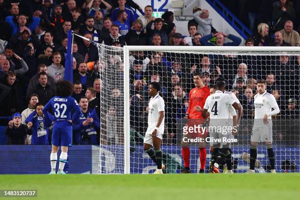 Thibaut Courtois of Real Madrid reacts after saving a shot from Marc Cucurella of Chelsea during the UEFA Champions League quarterfinal second leg...