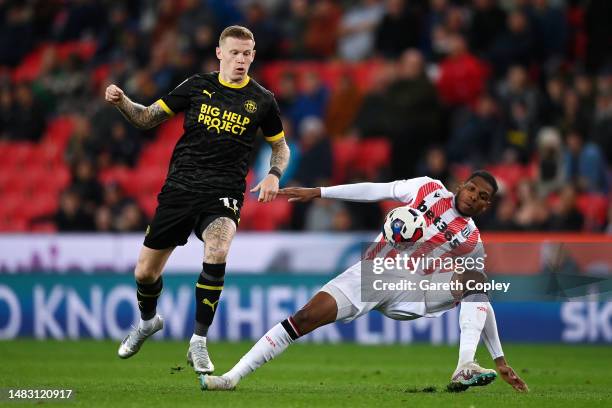 James McClean of Wigan Athletic is challenged by Dujon Sterling of Stoke City during the Sky Bet Championship match between Stoke City and Wigan...