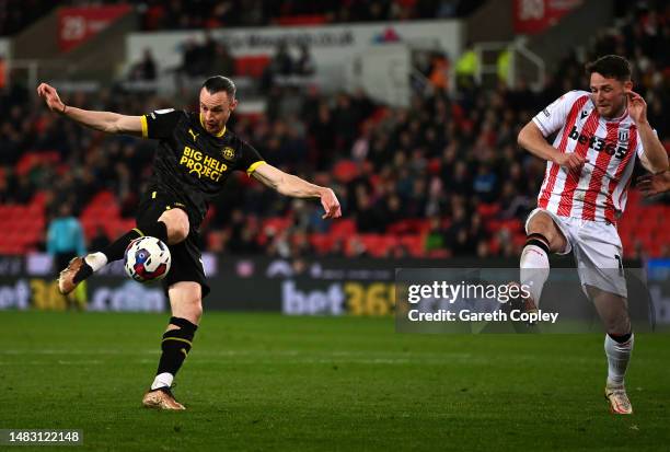 Will Keane of Wigan Athletic scores the team's first goal during the Sky Bet Championship match between Stoke City and Wigan Athletic at Bet365...