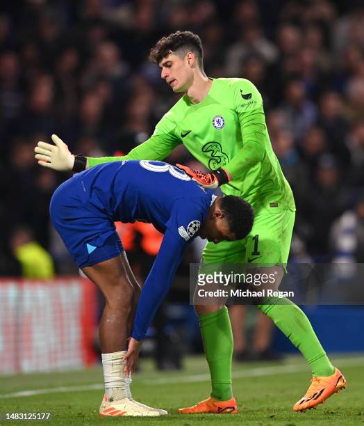 Wesley Fofana of Chelsea is consoled by team mate Kepa Arrizabalaga after Rodrygo of Real Madrid scored the team's first goal during the UEFA...