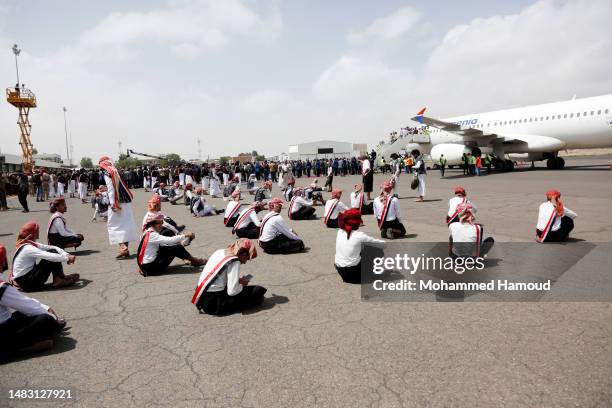 Yemenis get ready to perform a traditional dance named Barra as they welcome the arrival of conflict detainees at the Sana'a International Airport...