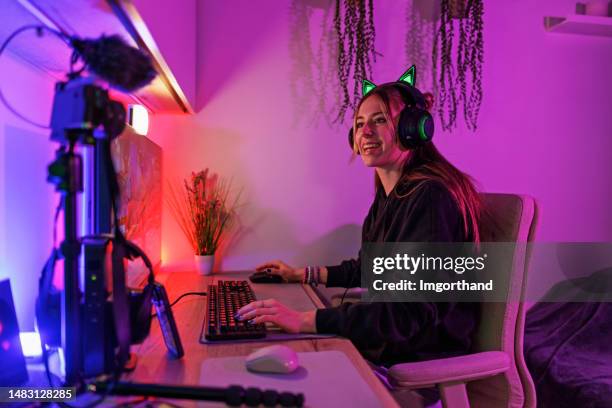 teenage girl streaming playing video game on desktop pc - live streaming stock pictures, royalty-free photos & images