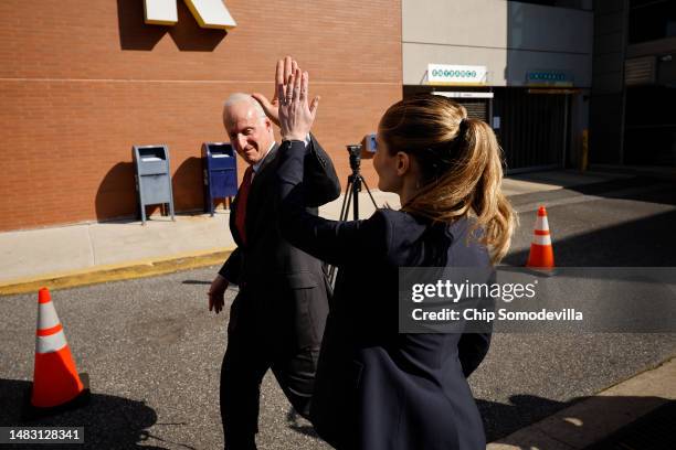 Lawyers representing Dominion Voting Systems Rodney Smolla and Valerie Caras high-five as they leave the Leonard Williams Justice Center following a...