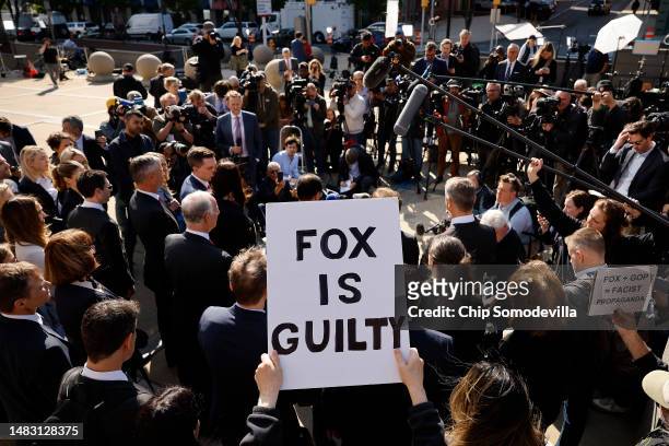 Lawyers representing Dominion Voting Systems talk to reporters outside the Leonard Williams Justice Center following a settlement with FOX News in...