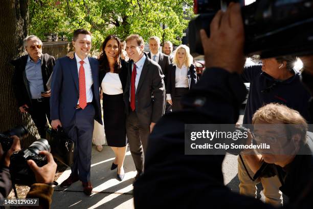 Lawyers for Dominion Voting Systems Stephen Shackelford, Davida Brook and Justin Nelson pose for photographers after leaving the Leonard Williams...