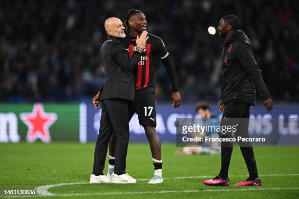 Stefano Pioli, Head Coach of AC Milan, celebrates victory with Rafael Leao of AC Milan during the UEFA Champions League Quarterfinal Second Leg match...