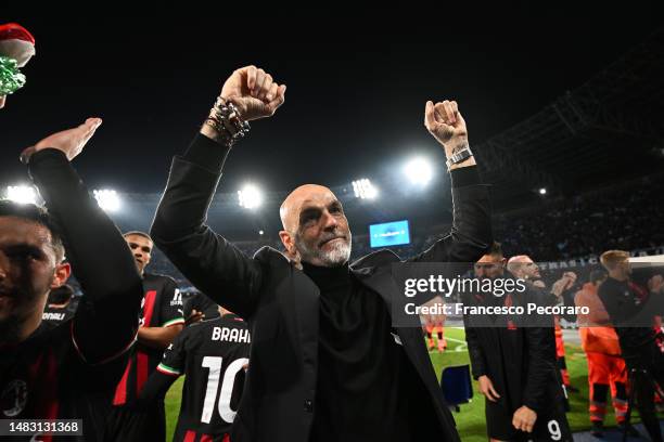 Stefano Pioli, Head Coach of AC Milan, celebrates victory in front of their fans after defeating SSC Napoli during the UEFA Champions League...