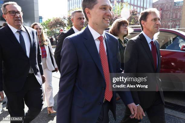 Dominion Voting Systems CEO John Poulos leaves with members of his legal team, including Justin Nelson and Stephen Shackelford from the Leonard...