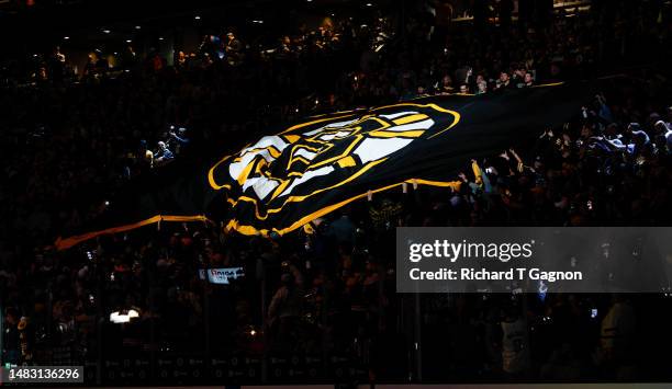 The Boston Bruins flag marches across the TD Garden crowd before a game between the Boston Bruins and the Florida Panthers before Game One of the...