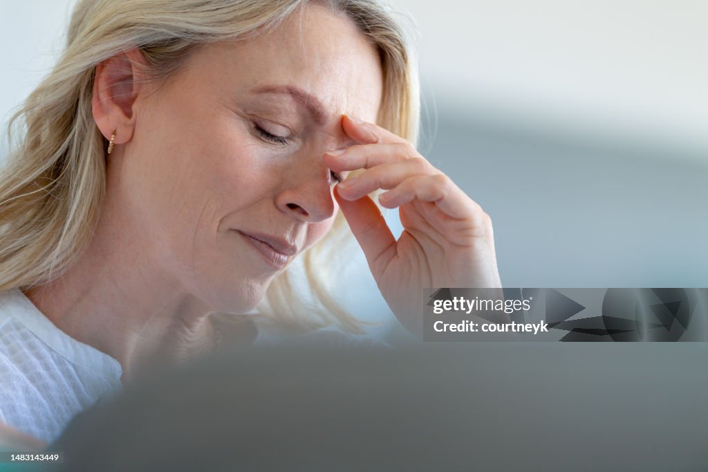 Upset stressed mature woman close up.