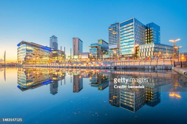 manchester england salford quays skyline reflection - manchester england stock pictures, royalty-free photos & images