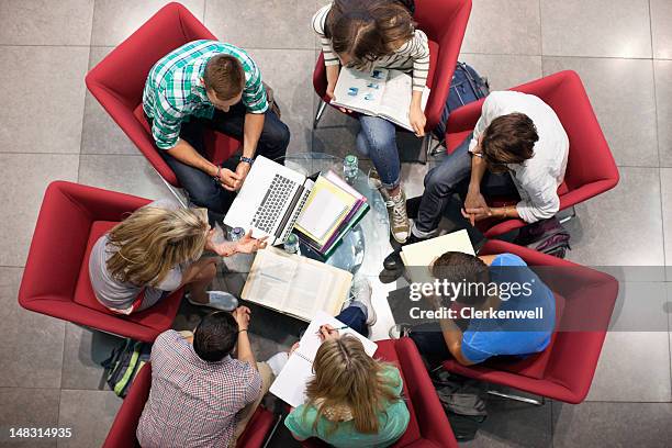 university students studying in a circle - team gb stockfoto's en -beelden