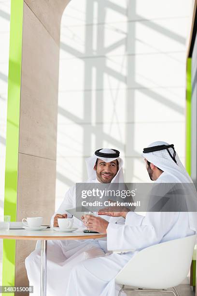 men in kaffiyeh drinking coffee - arab businessman stock pictures, royalty-free photos & images