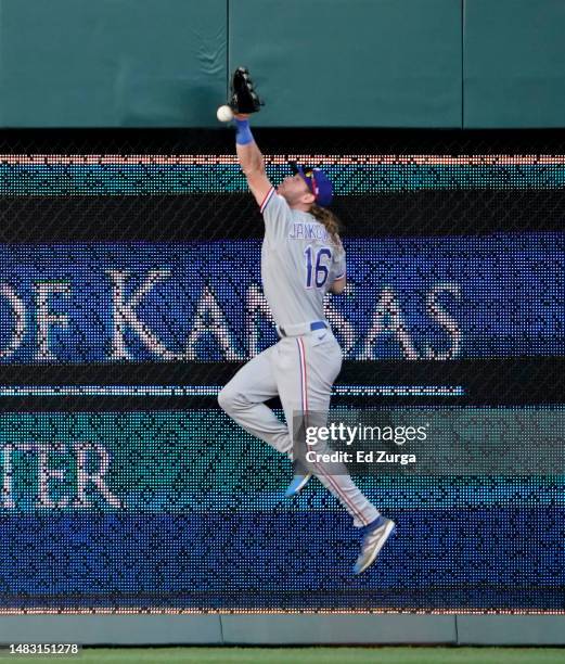 Ball hit by Salvador Perez of the Kansas City Royals gets past Travis Jankowski of the Texas Rangers for a double in the first inning at Kauffman...