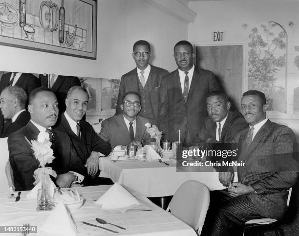 Lunch with Reverend Dr Martin Luther King Jr. And other leaders of the Civil Rights movement. Seated, Dr Martin Luther King, Roy Wilkins, Robert...