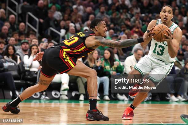 John Collins of the Atlanta Hawks defends Malcolm Brogdon of the Boston Celtics during the fourth quarter of Game Two of the Eastern Conference First...