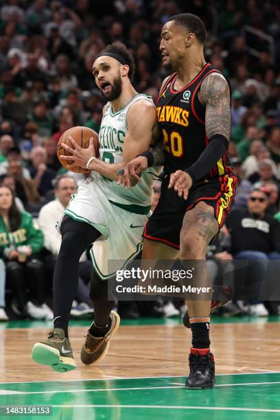 Derrick White of the Boston Celtics drives to the basket against John Collins of the Atlanta Hawks during the fourth quarter of Game Two of the...