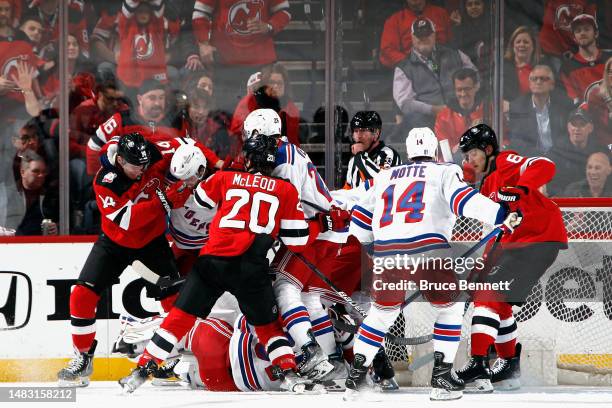 The New Jersey Devils and the New York Rangers battle during the third period during Game One in the First Round of the 2023 Stanley Cup Playoffs at...