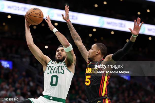 Jayson Tatum of the Boston Celtics takes a shot against Dejounte Murray of the Atlanta Hawks during the fourth quarter of Game Two of the Eastern...