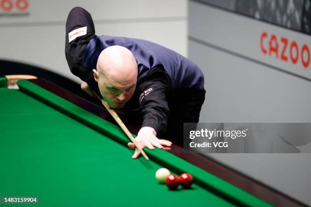 Elliot Slessor of England plays a shot in the first round match against Gary Wilson of England on day 4 of the 2023 Cazoo World Championship at...