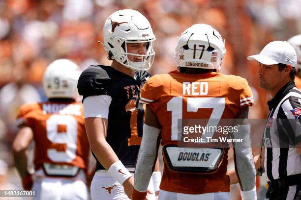 Arch Manning of the Texas Longhorns talks with Savion Red during the Texas Football Orange-White Spring Football Game at Darrell K Royal-Texas...