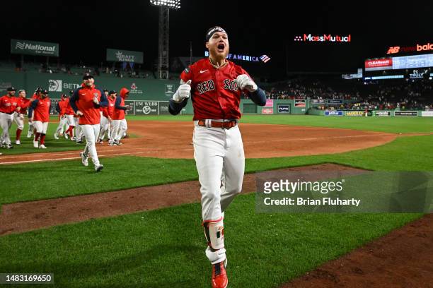 Alex Verdugo of the Boston Red Sox reacts after hitting a RBI single against the Minnesota Twins during the tenth inning of a game at Fenway Park on...