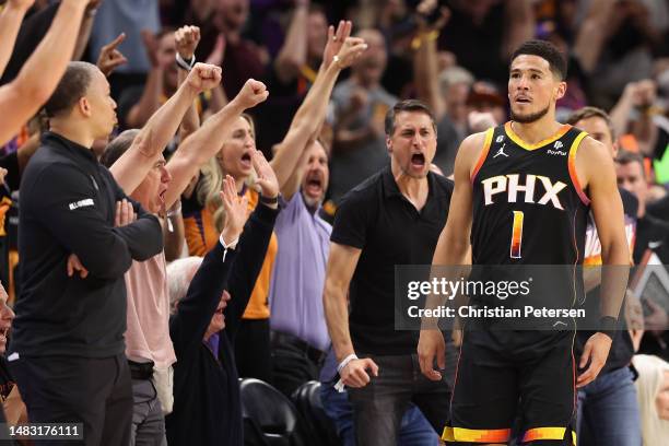 Devin Booker of the Phoenix Suns reacts after hitting a three-point shot against the LA Clippers during the first half of Game Two of the Western...