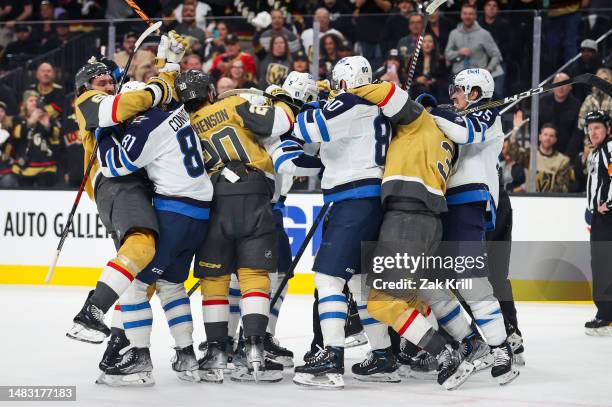 Vegas Golden Knights and Winnipeg Jets players fight during the second period in Game One of the First Round of the 2023 Stanley Cup Playoffs at...