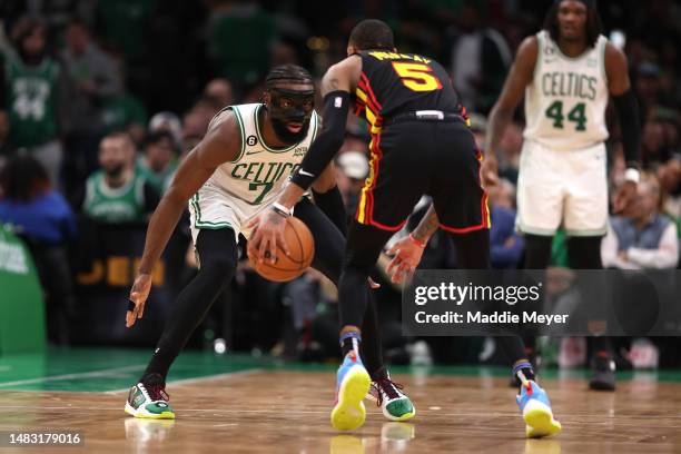 Jaylen Brown of the Boston Celtics defends Dejounte Murray of the Atlanta Hawks during the fourth quarter of Game Two of the Eastern Conference First...