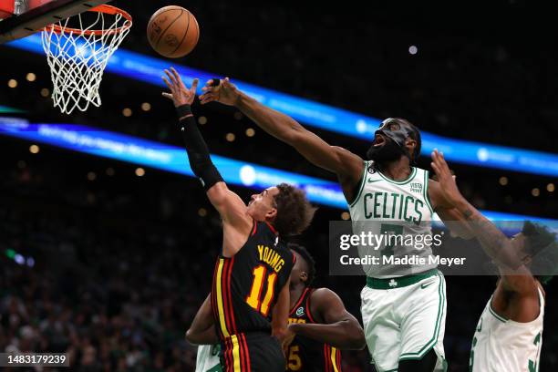 Jaylen Brown of the Boston Celtics defends a shot from Trae Young of the Atlanta Hawks during the second quarter of Game Two of the Eastern...