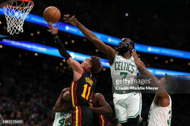 Jaylen Brown of the Boston Celtics defends a shot from Trae Young of the Atlanta Hawks during the second quarter of Game Two of the Eastern...