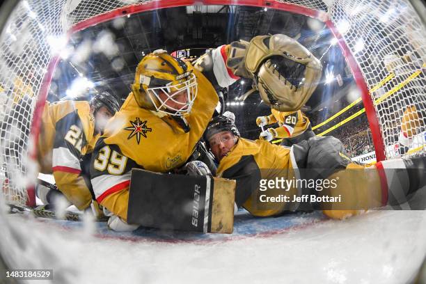 Laurent Brossoit of the Vegas Golden Knights and Brayden McNabb defend the net during the first period against the Winnipeg Jets in Game One of the...