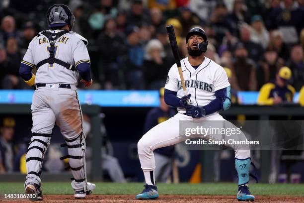 Teoscar Hernandez of the Seattle Mariners reacts after striking out during the tenth inning against the Milwaukee Brewers at T-Mobile Park on April...