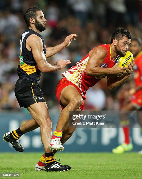 Karmichael Hunt of the Suns marks in the final seconds before kicking the match winning goal after the final siren during the round 16 AFL match...