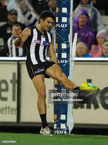 Chris Tarrant of the Magpies kicks a goal during the AFL Round 16 game between the Geelong Cats and the Collingwood Magpies at the Melbourne Cricket...