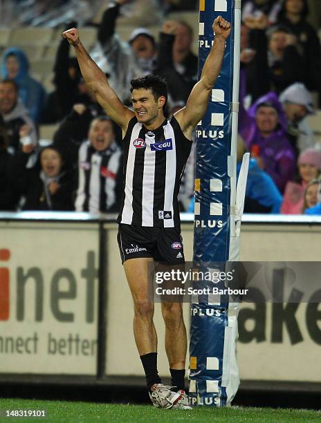 Chris Tarrant of the Magpies celebrates after kicking a goal during the AFL Round 16 game between the Geelong Cats and the Collingwood Magpies at the...