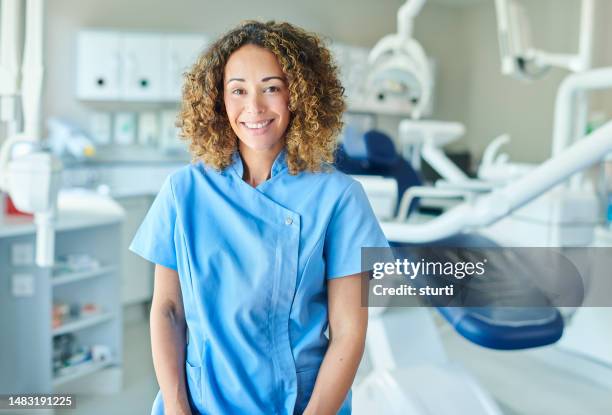 happy dental nurse portrait - dental technician stock pictures, royalty-free photos & images
