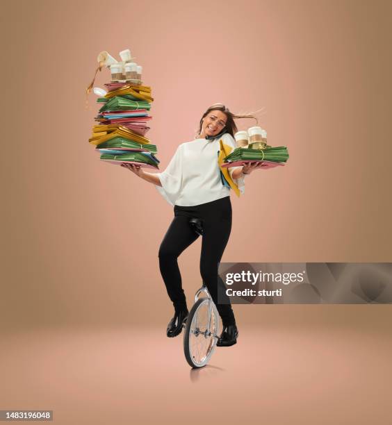 unicycling office junior - woman juggling stock pictures, royalty-free photos & images