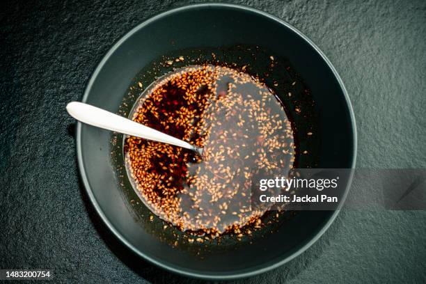 spicy pepper in oil - sesame oil stock pictures, royalty-free photos & images