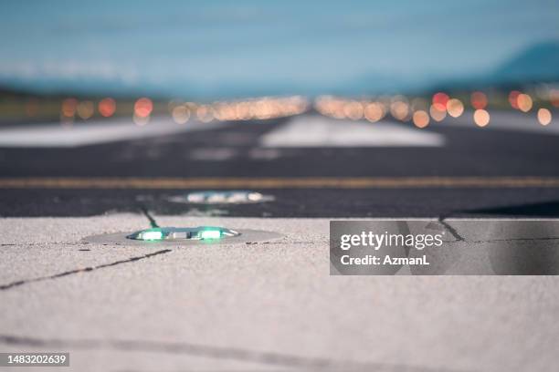 green light on the airports runway - taxiway stock pictures, royalty-free photos & images