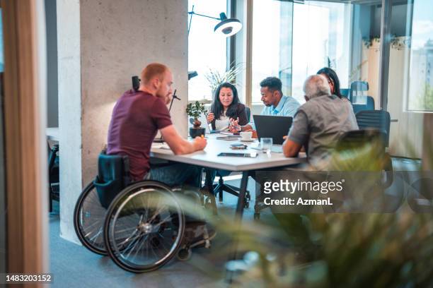 indoor shot of caucasian, latin and multiracial coworkers - diversity workplace stock pictures, royalty-free photos & images