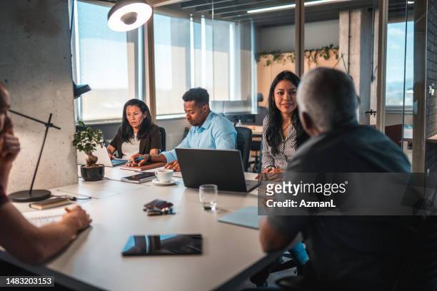 businessmen and businesswomen working overtime at office - colleagues stock pictures, royalty-free photos & images