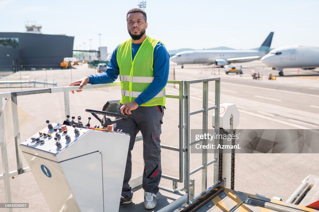 Sadiq Loder Driver Airport Worker Driving A Cargo Loader On A Runway High-Res Stock Photo ...