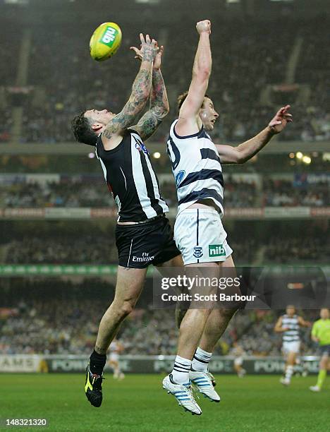 Dane Swan of the Magpies and Steve Johnson of the Cats compete for the ball during the AFL Round 16 game between the Geelong Cats and the Collingwood...