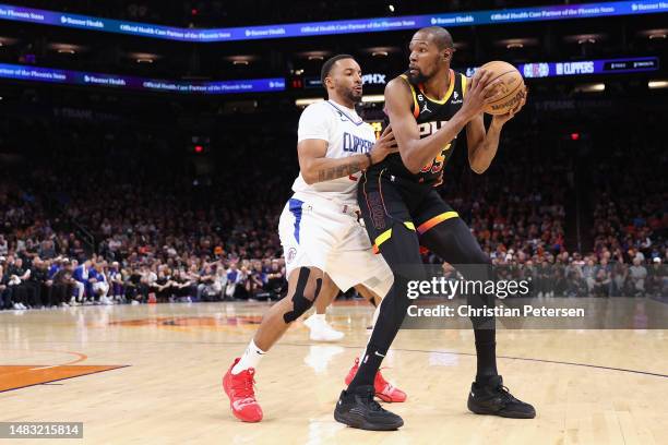 Kevin Durant of the Phoenix Suns handles the ball against Norman Powell of the LA Clippers during the second half of Game Two of the Western...