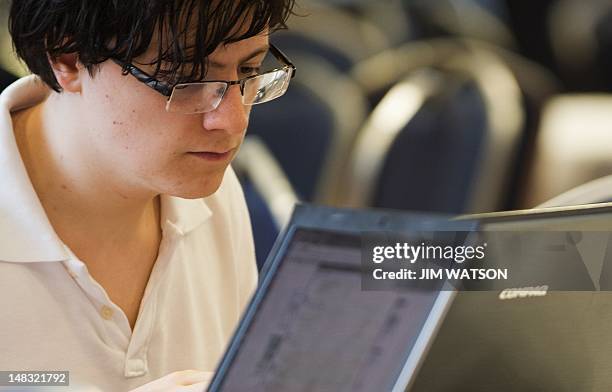 By Rob Lever, US-IT-INTERNET-SOCIETY-WIKIPEDIA Computer hackers participate in the Wikimania Hackathon at George Washington University in Washington,...