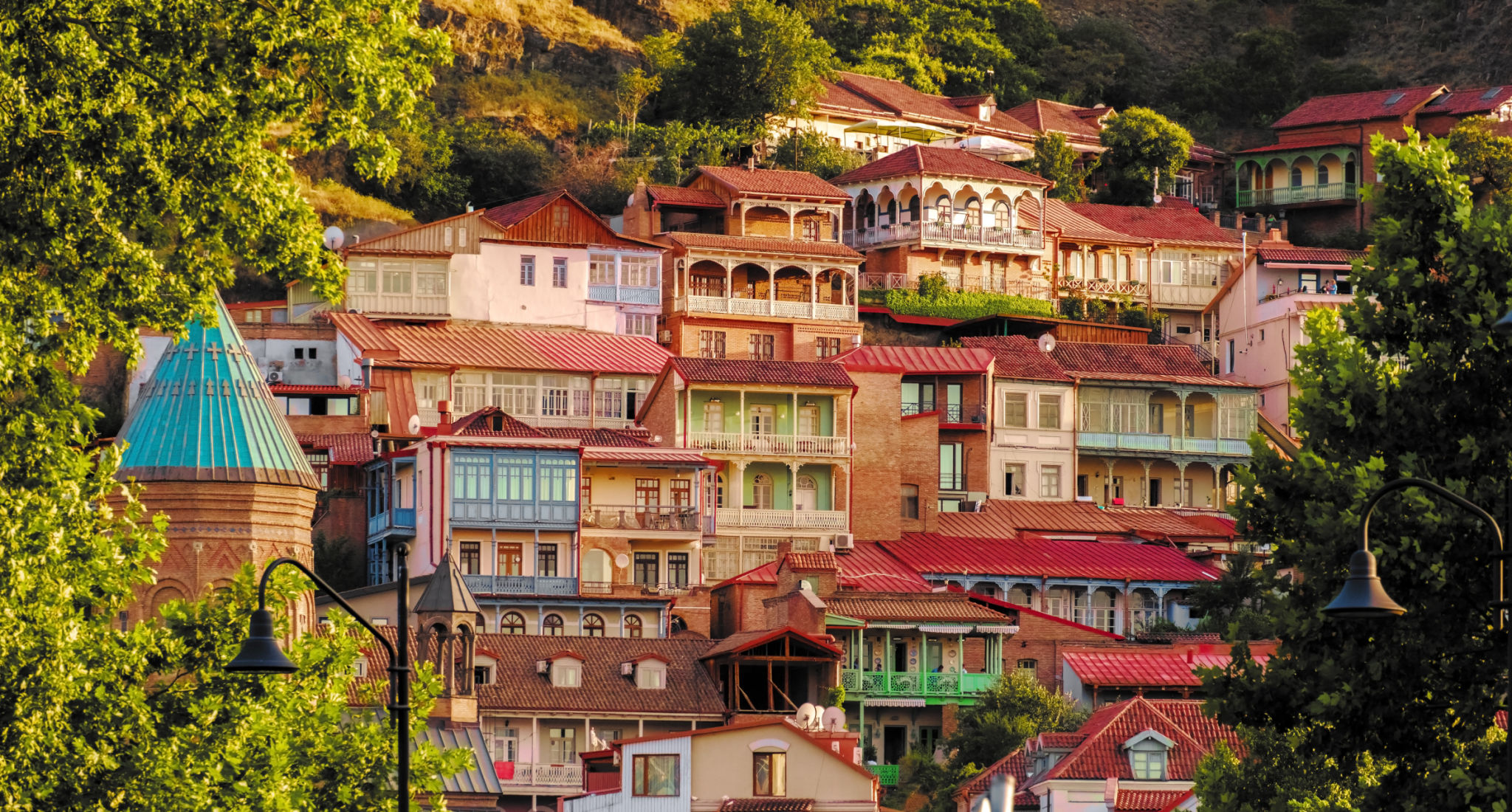 Colorful traditional houses with wooden carved balconies in the Old Town of Tbilisi, Georgia. Colorful traditional houses with wooden carved balconies in the Old Town of Tbilisi, Georgia.