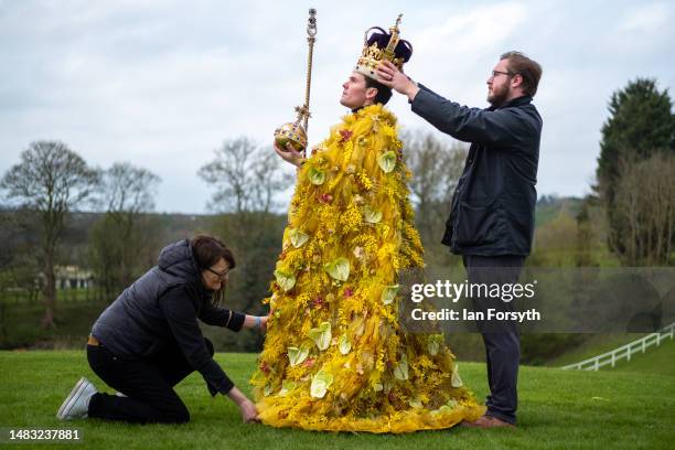 Finishing touches are made as Rupert North wears the ‘floral’ coronation cloak, designed by award-winning, Harrogate based florist Helen James during...